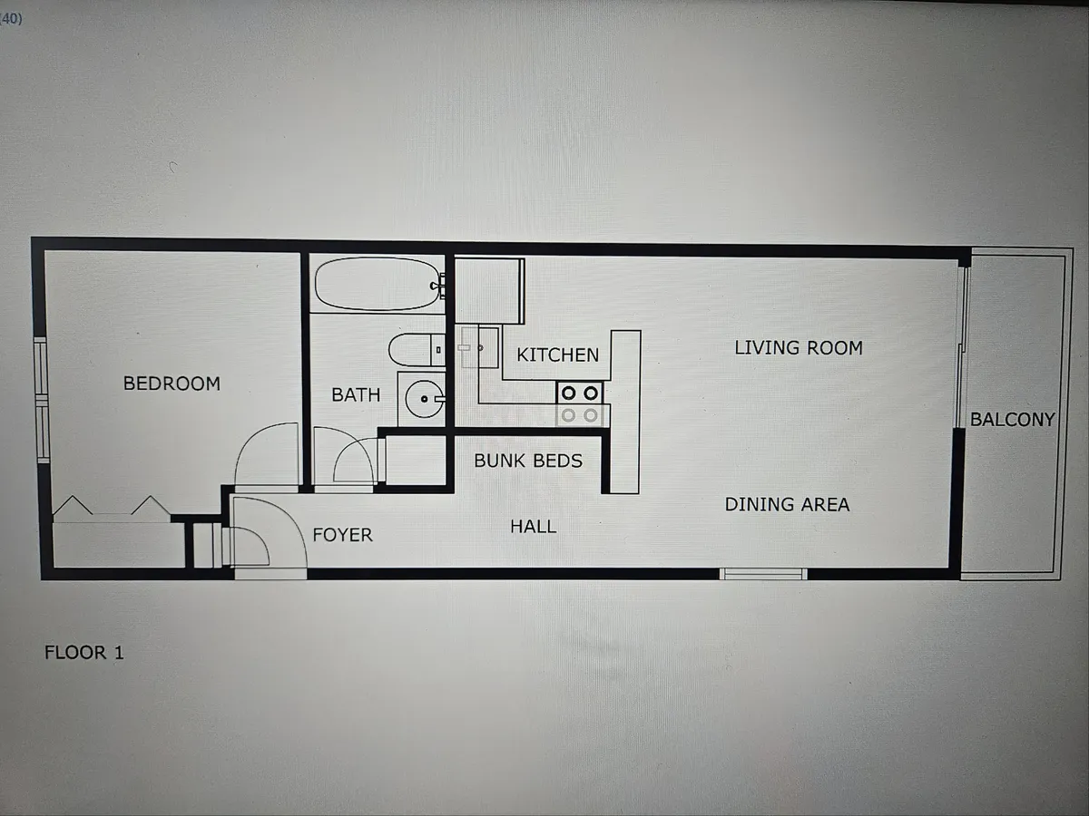 An inviting view of a modern interior with a fully equipped kitchen, cozy bunk beds, a spacious living room, and a balcony with views. The scene is staged for family gatherings, meals, and relaxation, offering a glimpse into the comforts available after a day of adventure.